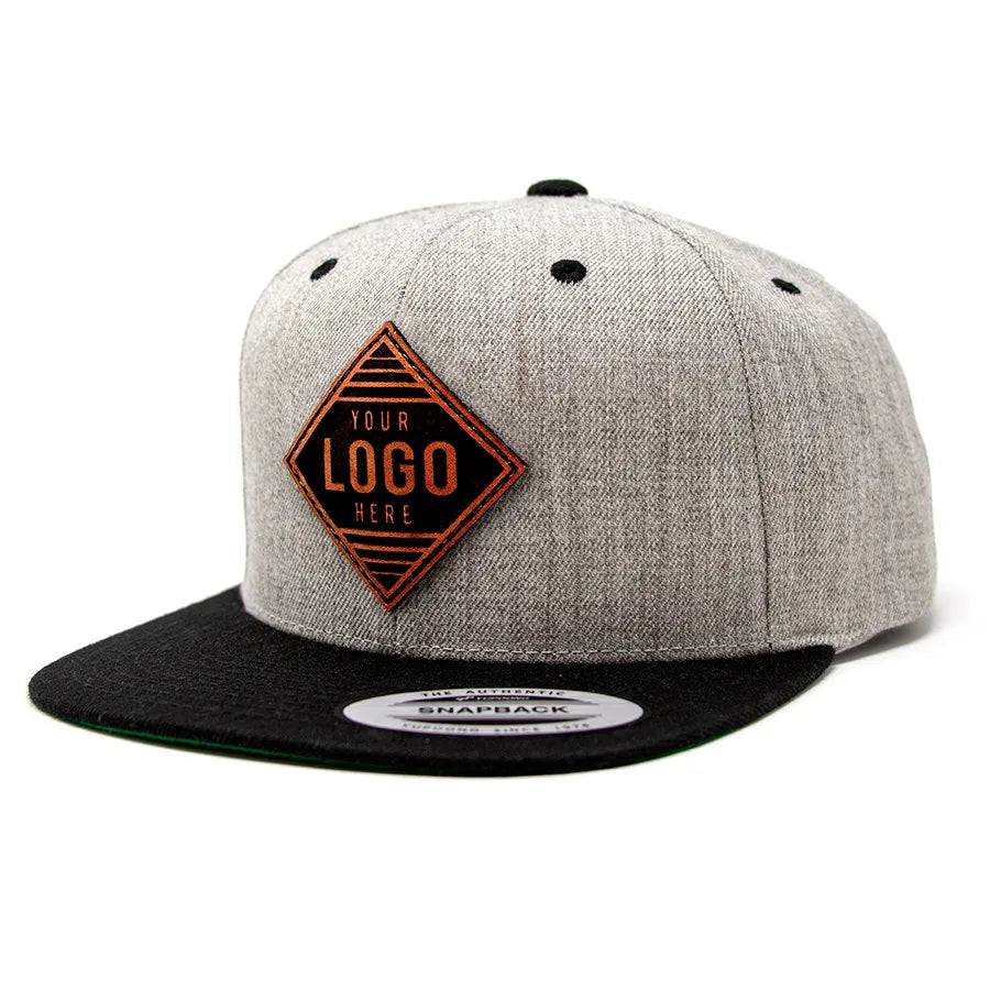 19-LP Yupoong Leather Patch Trucker Cap